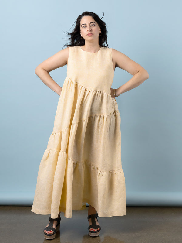 Sewn sample of the Azure dress sewing pattern by Closet Core Patterns in pale yellow linen, front view with tiered skirt.