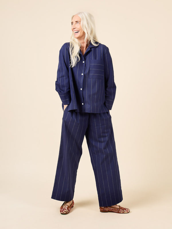 Sewn sample of the Fran pajamas sewing pattern by Closet Core Patterns in navy pinstripe, top and wide leg pants, front view.