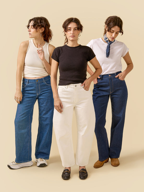 Sewn sample of the Frank jeans sewing pattern by Closet Core Patterns in blue denim and white, three leg shapes, front view.