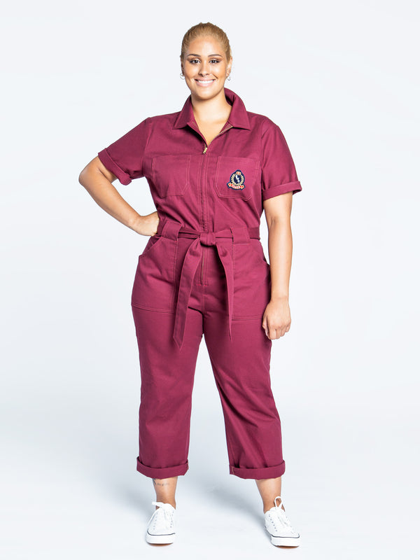 Sewn sample of the Blanca jumpsuit sewing pattern by Closet Core Patterns in burgundy twill, front view with tie belt.