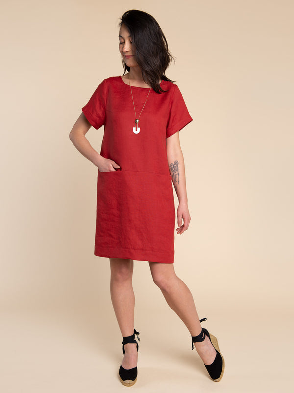 Sewn sample of the Cielo top + dress sewing pattern by Closet Core Patterns in red linen, front view with cuffed short sleeves.