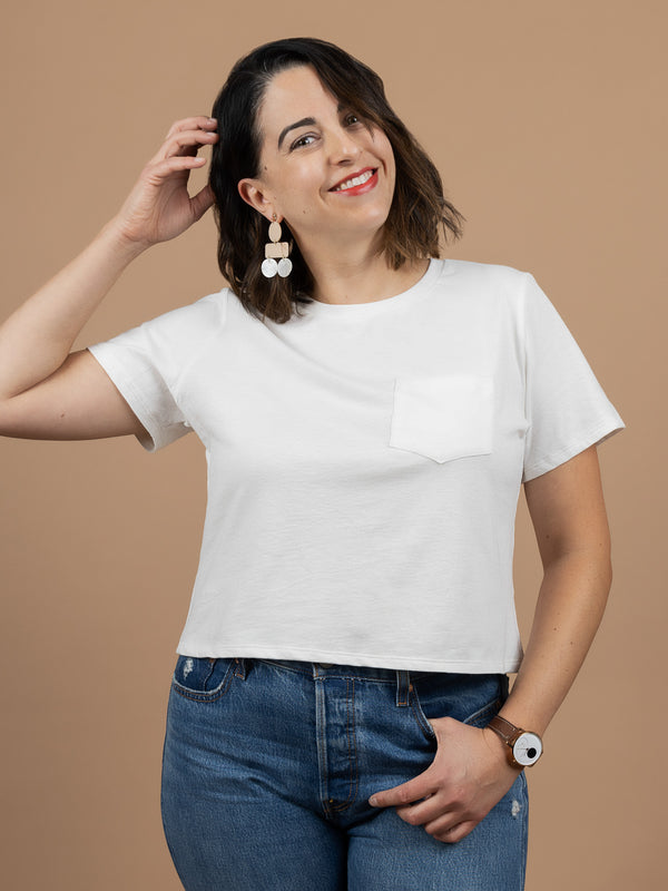 Sewn sample of the Core T-Shirt sewing pattern by Closet Core Patterns in white knit, cropped front view with patch pocket.