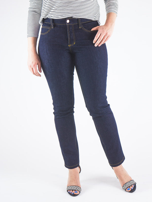 Sewn sample of the Mid-Rise Ginger jeans sewing pattern by Closet Core Patterns in dark indigo denim, front view with gold topstitching.