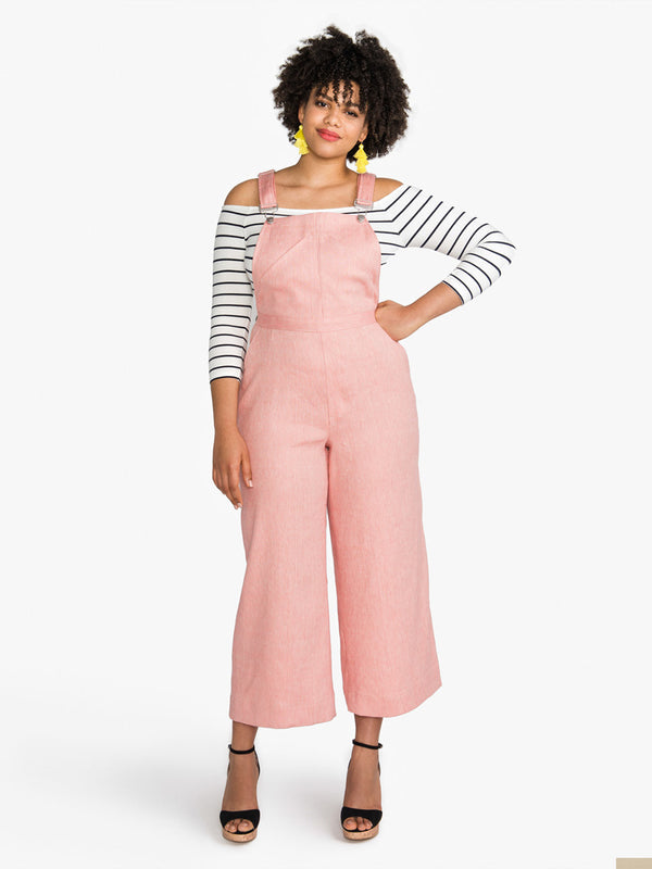 Sewn sample of the Jenny overalls + trousers sewing pattern by Closet Core Patterns in pink denim, front view with wide cropped legs.