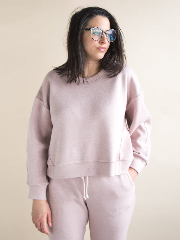 Sewn sample of the Mile End sweatshirt sewing pattern by Closet Core Patterns in dusty pink fleece, front view with drop shoulders.