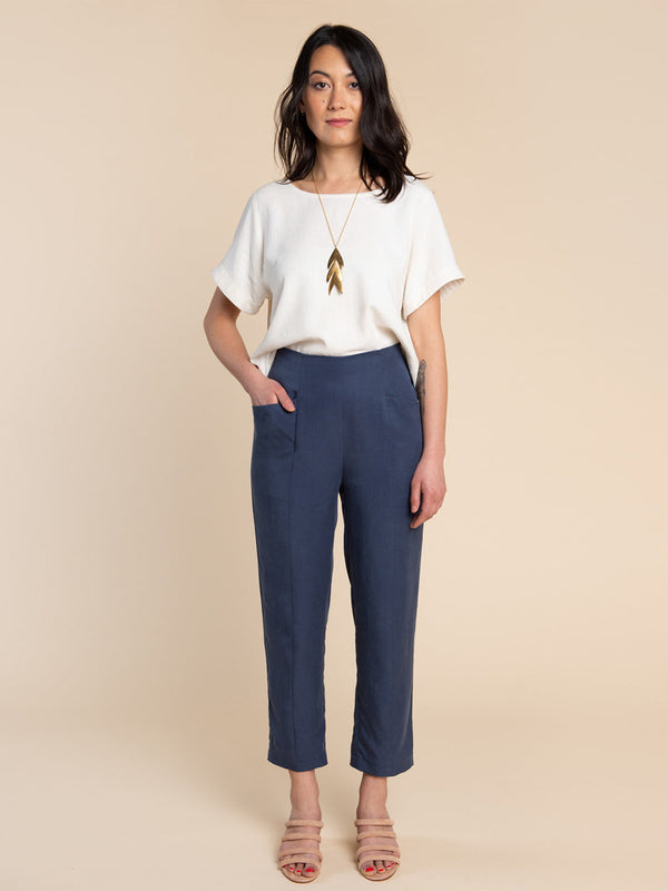 Sewn sample of the Pietra pants + shorts sewing pattern by Closet Core Patterns in navy, tapered leg front view with slanted hip pockets.